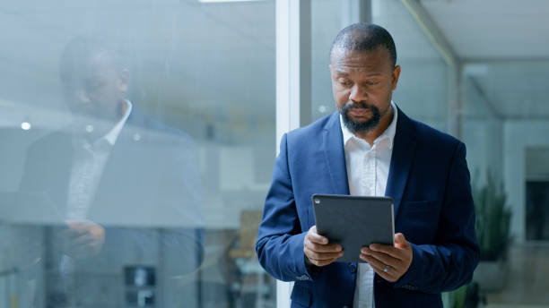 istock Businessman, tablet and reading email communication or working on tech device for planning stratergy. Corporate ceo, digital marketing and web netowrking or startup management on ipad in office 1446848672