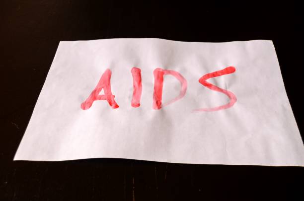 istock Word Aids Text Written with Blood on White Paper 1446848848