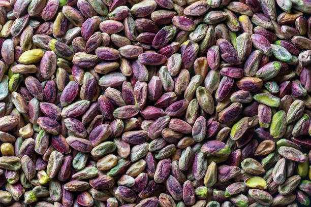 istock Pile pistachio kernels nuts without shell, closeup. Pistachios without shell, top view. Whole nut kernels 1446850658