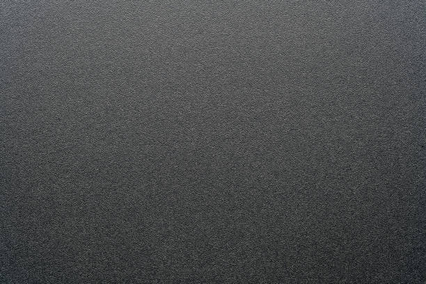 istock Rough black plastic background and texture. Black plastic material, closeup 1446850689