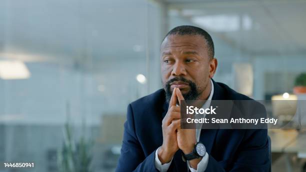 Black Man Anxiety And Thinking In Burnout Stress Or Depression From Mistake At The Office Businessman Employee Suffering In Mental Health Problem Or Strained With Fatigue From Job At Company Stock Photo - Download Image Now