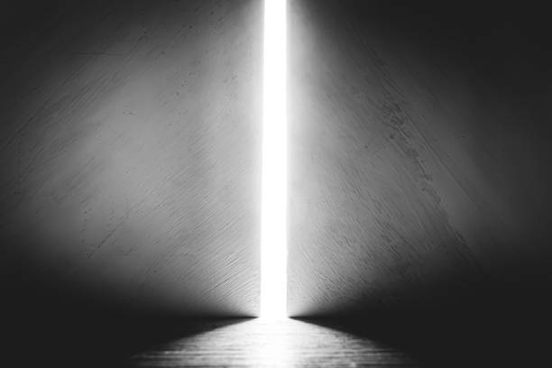 istock Bright light between two walls. Light from the opening large stone gate, portal. A light in the end of a tunnel. The concept of success, freedom of choice, open mind, meditation. 1446853387
