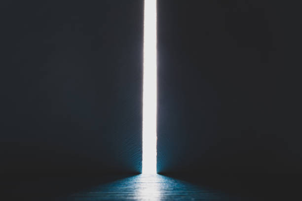 istock Bright light between two walls. Light from the opening large stone gate, portal. A light in the end of a tunnel. The concept of success, freedom of choice, open mind, meditation. 1446853388