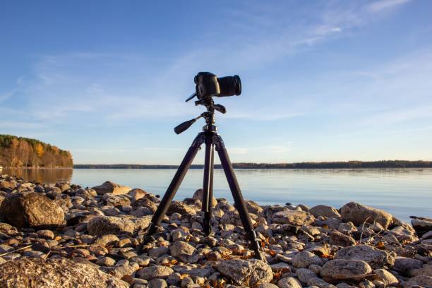 istock View of the camera on tripod on the rocky beach 1446856210
