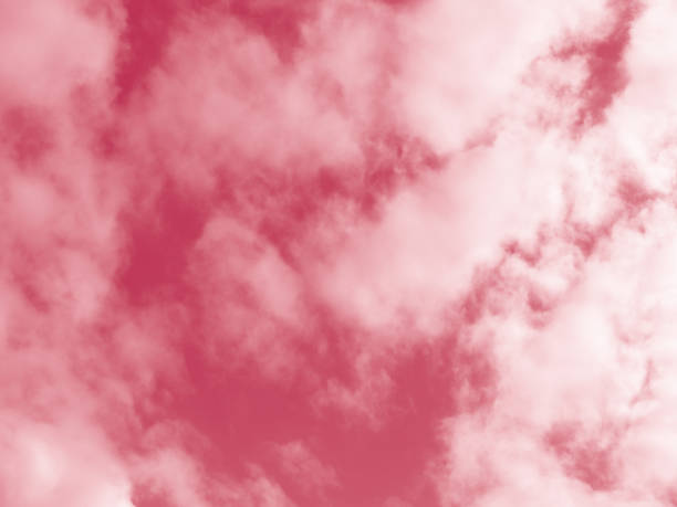 istock Beautiful fluffy white cloud against the Magenta sky. Sky clouds.  Abstract background texture. Copy space. The concept of hope. Color 2023 Viva Magenta 1446857335