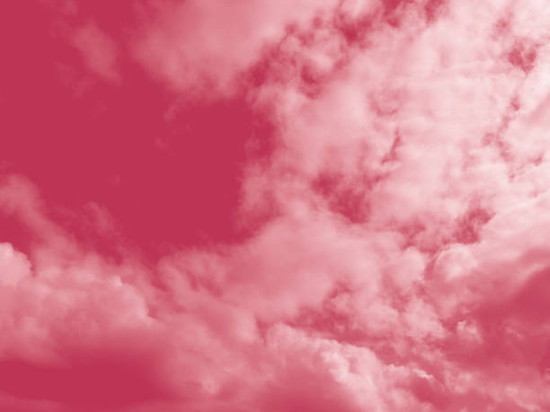 istock Beautiful fluffy white cloud against the Magenta sky. Sky clouds.  Abstract background texture. Copy space. The concept of hope. Color 2023 Viva Magenta 1446857347