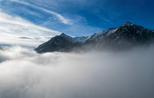 Mountain range above the fog and clouds