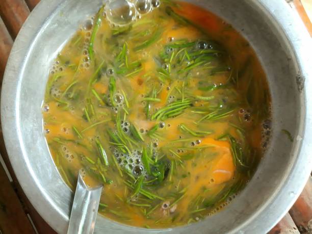 istock Cooking Egg Omelet and Acacia leaf - food preparation. 1446864508
