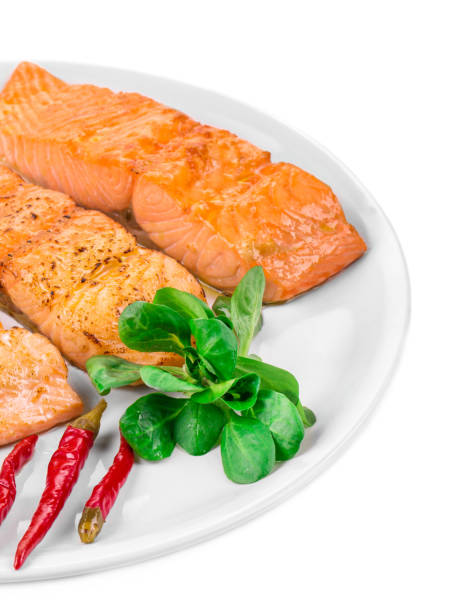 istock Grilled salmon fillet with vegetables on plate. 1446864908