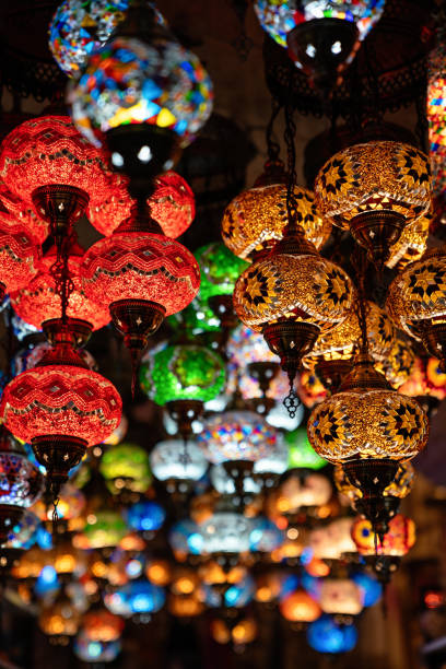 Oriental colorful glass hanging lamps or lanterns in turkish bazaar Beautiful oriental colorful glass hanging lamps or lanterns in turkish bazaar oriental culture stock pictures, royalty-free photos & images
