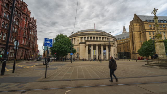 Time lapse of Crowded Commuter People and Tourist walking and traveling around Manchester Central Library, The Midland and Town Hall