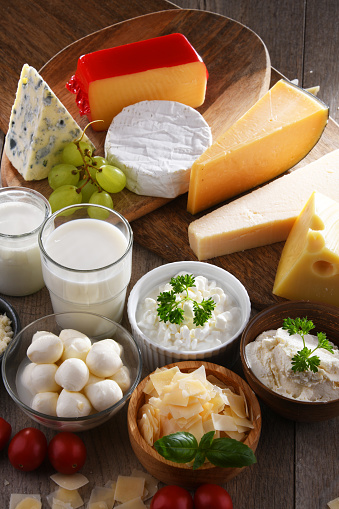 A variety of dairy products including cheese, milk and yogurt.