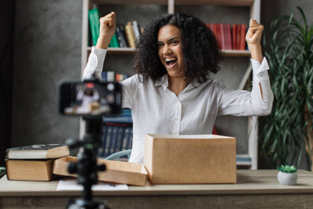 istock Multiracial woman vlogging in home office 1446873733