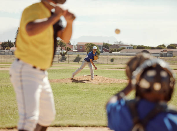 istock Baseball, bat and man ready for a fast ball on a baseball field in a training match or game outdoors in Houston. Softball, fitness and sports athlete pitcher pitching with speed in a team performance 1446873872