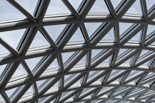 istock Triangle pattern of building glass roof structure. Architectural glass roof structure with a geometric triangle pattern. 1446875470