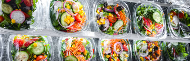 istock Boxes with pre-packaged vegetable salads in a commercial fridge 1446875514