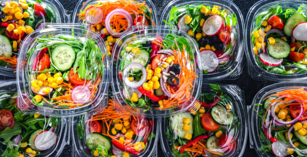 istock Boxes with pre-packaged vegetable salads in a commercial fridge 1446875527