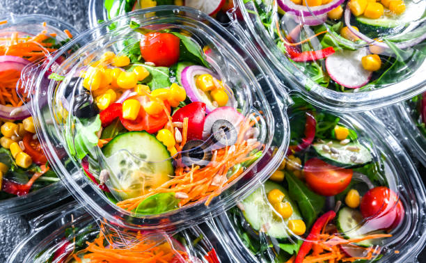 istock Boxes with pre-packaged vegetable salads in a commercial fridge 1446875558