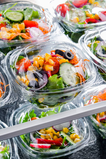 istock Boxes with pre-packaged vegetable salads in a commercial fridge 1446875584
