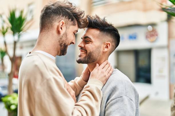 istock Young couple smiling confident hugging each other at street 1446877190