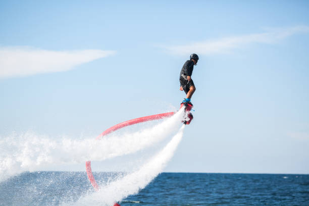 istock Silhouette of a fly board rider at sea. 1446877246