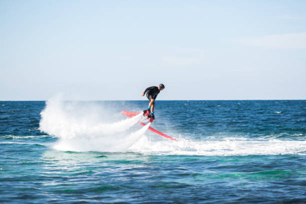 istock Silhouette of a fly board rider at sea. 1446877370