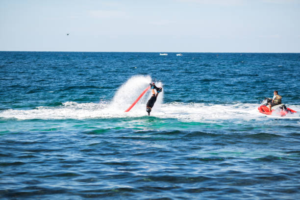 istock Silhouette of a fly board rider at sea. 1446878357