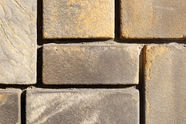 stone carved in square shapes, work of a stonemasonry craftsman stock photo