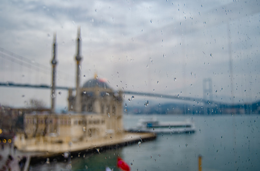 mosque rain Ortakoy sea landscape bridge istanbul