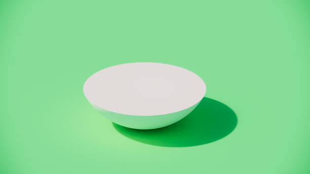 istock 3D white half round display stands on green background. 1446880726