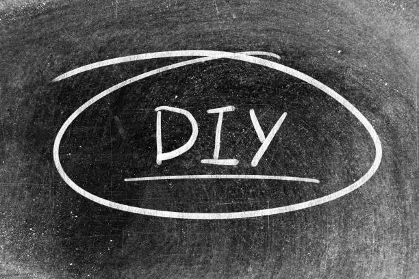 istock White chalk hand writing in word DIY (abbreviation of do it yourself) on blackboard background 1446880847