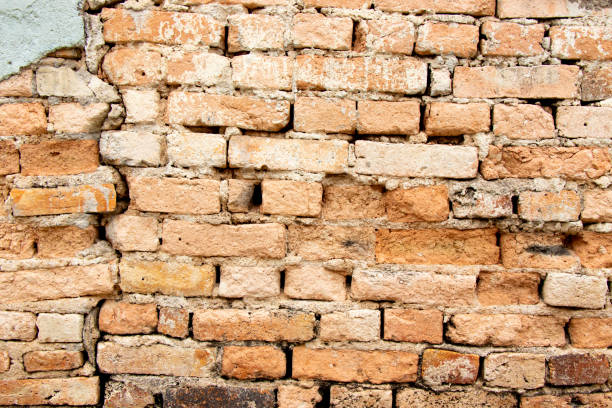 istock Grunge old and crack red color brick pattern wall textured background. 1446881035