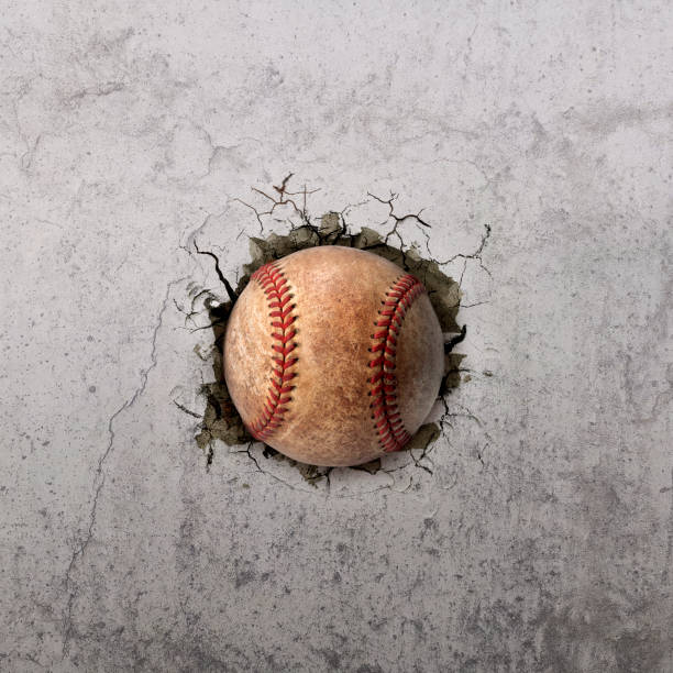 palla da baseball che vola attraverso il muro con crepe - baseballs baseball breaking broken foto e immagini stock