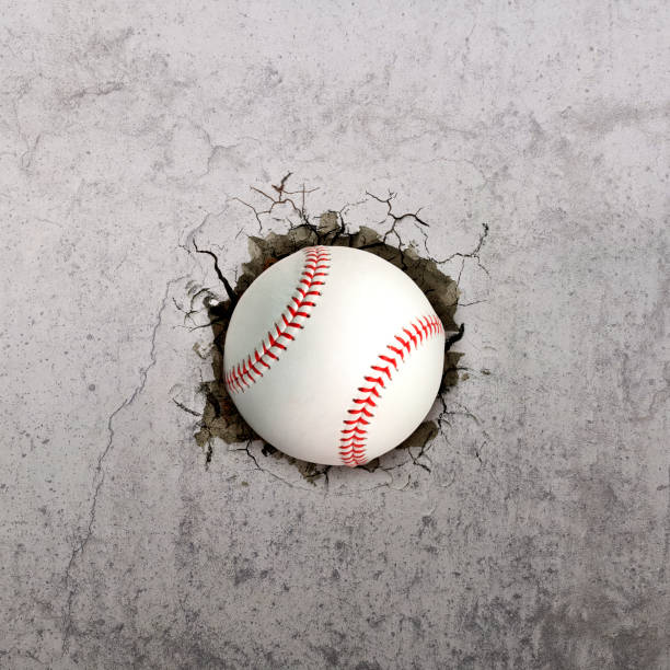 istock Baseball ball flying through the wall with cracks 1446881209