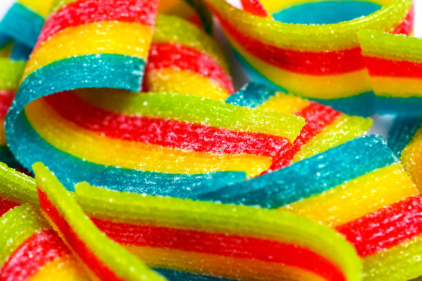 istock Rainbow sour jelly candies strips in sugar sprinkle. 1446881319