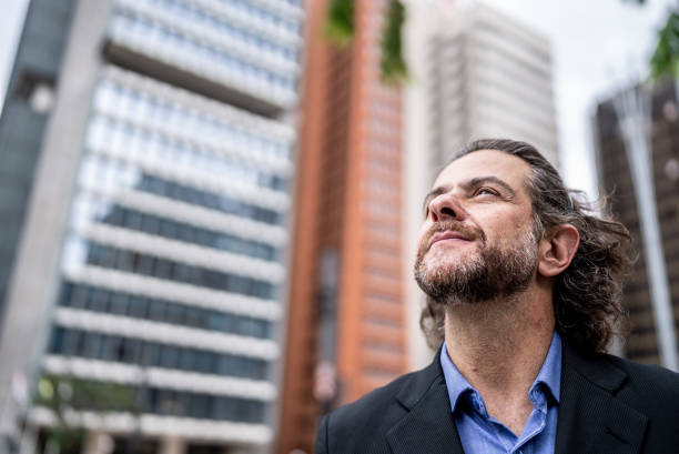 istock Businessman contemplating in a financial district 1446881418