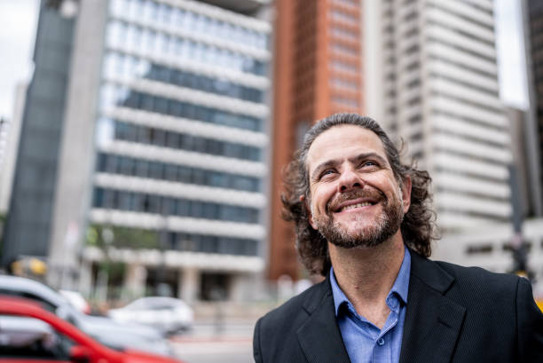 istock Businessman contemplating in a financial district 1446881419