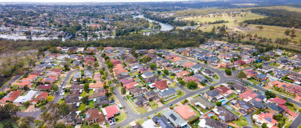 Panoramic aerial drone view of Voyager Point in South West Sydney, NSW Australia with Georges River in the background stock photo