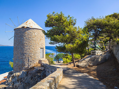 The old traditional windmill, found at the pathway leading from the port of Hydra to Kaminia in Hydra, Greece