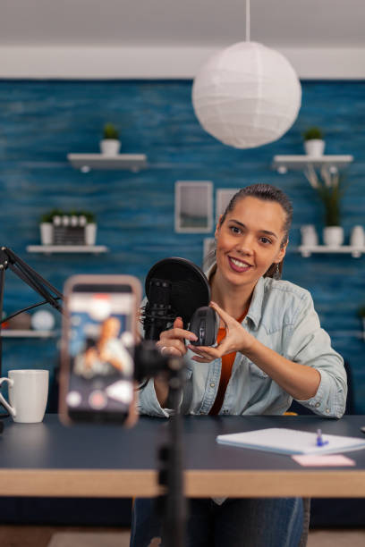 istock Content creator filming mouse review with mobile phone. 1446884116