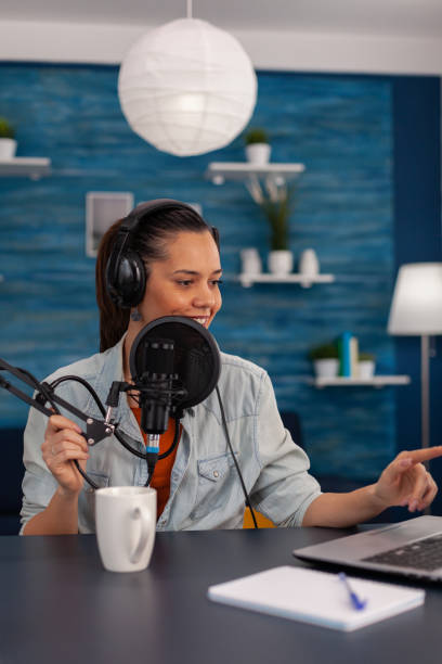 istock Content creator wearing headphones recording podcast 1446884128