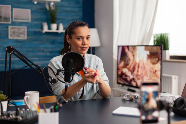 istock Content creator streaming makeup review for social media channel. 1446884158
