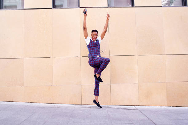 istock African-American man jumping for joy 1446884305