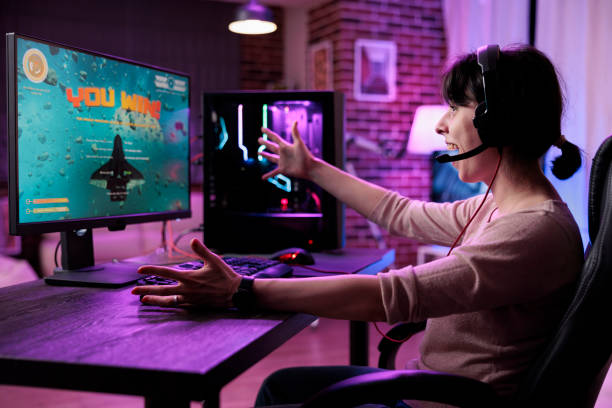 istock Young gamer celebrating video games championship win 1446884878