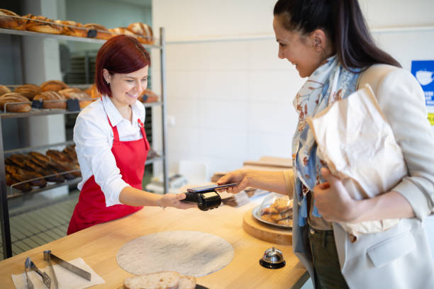 istock Customer buying and contactless paying in bakery 1446885242