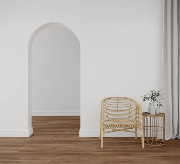 istock Empty white wall with rattan chair and coffee table on wooden floor. 1446885348