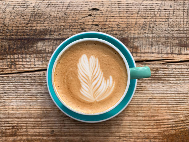 istock A cup of coffee latte on a wooden table 1446885391
