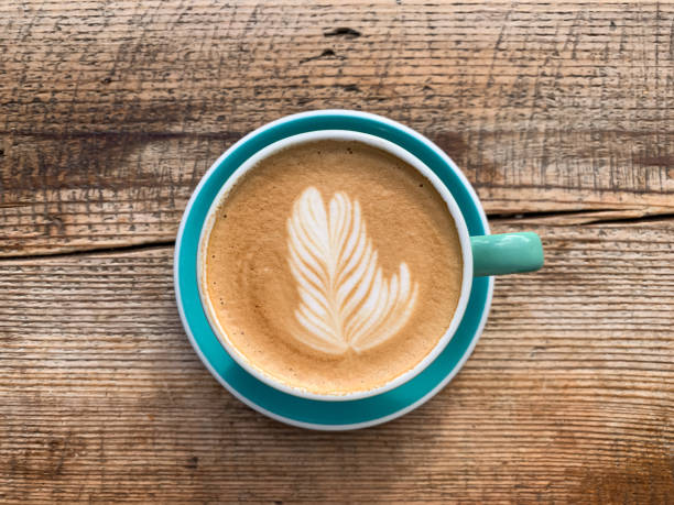 istock A cup of coffee latte on a wooden table 1446885393