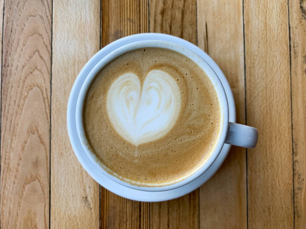 istock A cup of coffee latte on a wooden table 1446885398