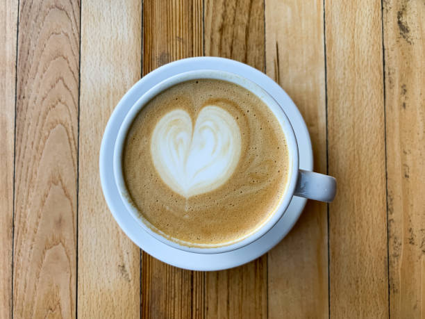 istock A cup of coffee latte on a wooden table 1446885437